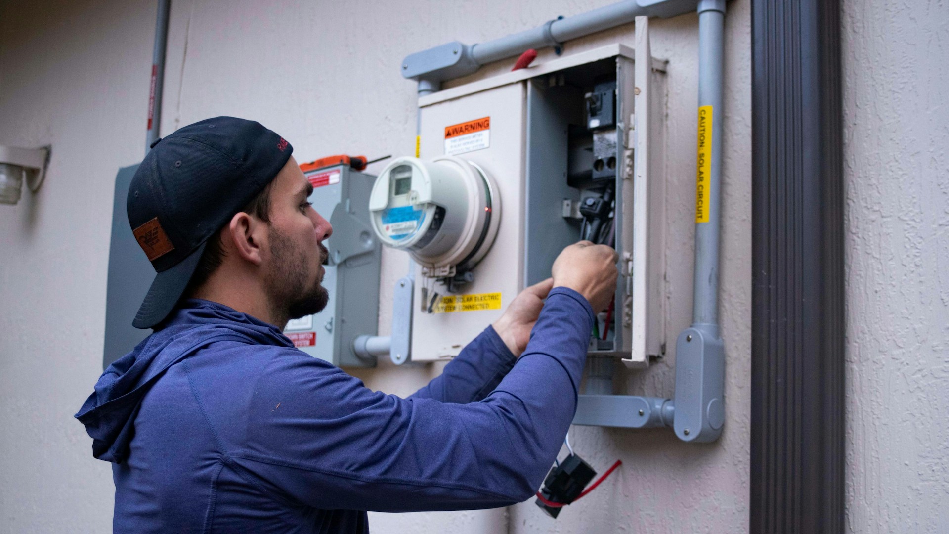 Technician inspecting a gas furnace heating system